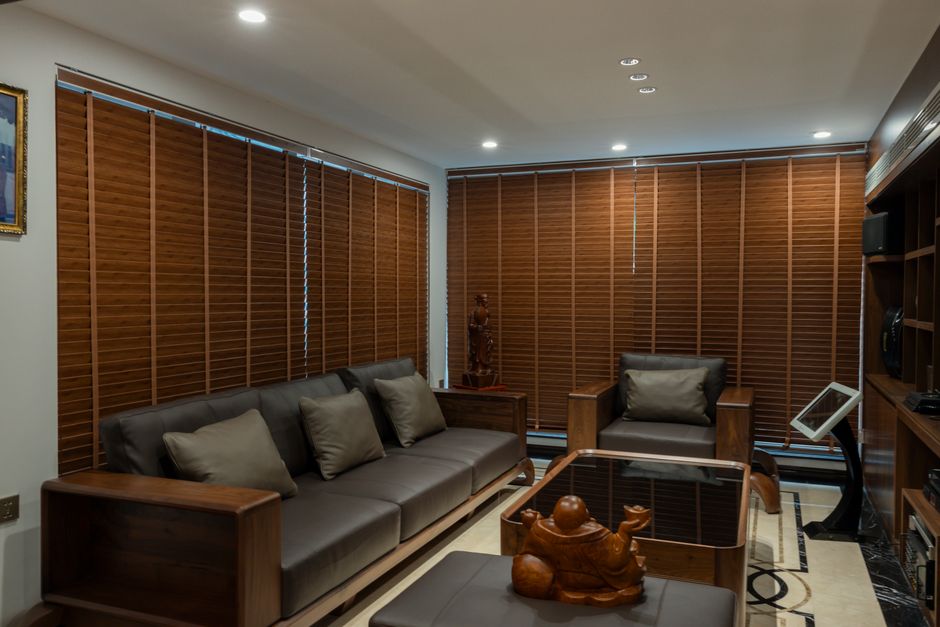 Modern living room with custom window blinds and natural light